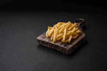 Fresh delicious crispy French fries with salt and spices