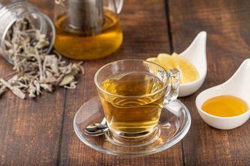 Freshly brewed hot winter tea on a wooden table