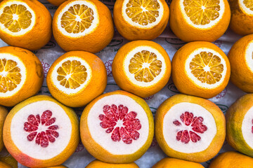 Ripe fresh oranges and grapefruits ready for squeezing juice.Selective focus.