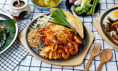 famous Thai dishes, "Pad thai" stir fried noodles with seafood Served in a pan.