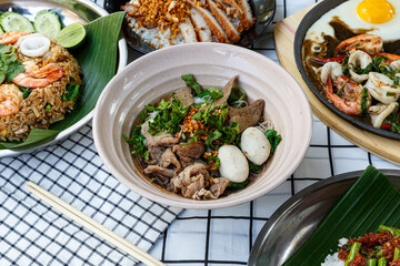 Pork boat noodles, thickened soup with stewed pork and pork ball, Braised pork and liver pork, Thai local. Ayutthaya recipe - obrazy, fototapety, plakaty