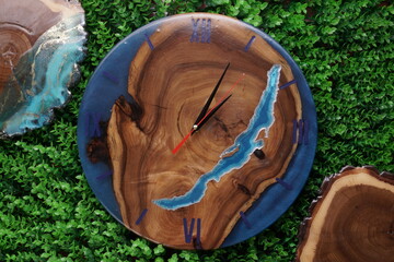 Wooden wall clock on background, top view