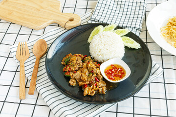Stir-fried sliced Beef with Holy Basil on the plate.Thai famous food (Pad Kra Pao). - obrazy, fototapety, plakaty