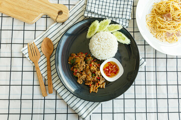 Stir-fried sliced Beef with Holy Basil on the plate.Thai famous food (Pad Kra Pao).