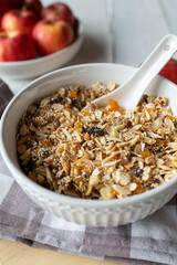 Homemade granola with amaranth, quinoa, almonds, oats, dried apricots, plums, apples and dates