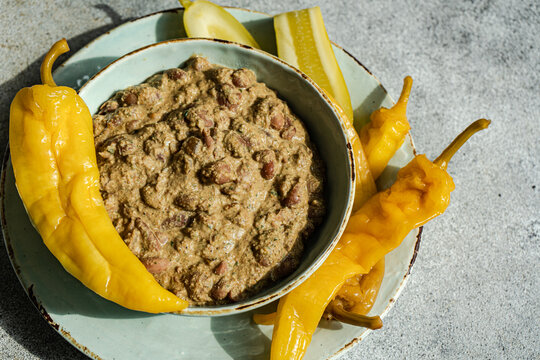 Overhead view of a bowl of traditional Georgian lobio with walnuts and fermented vegetables