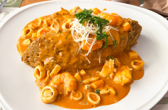 Traditional Peruvian rice with fish, crab and shrimp sauce