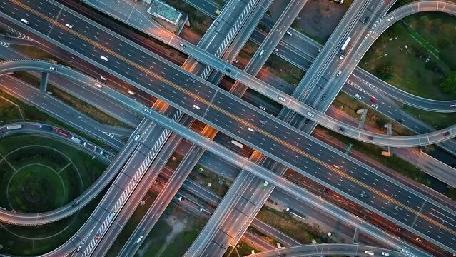 Title	
Aerial view of interchange and motorway road. transportation concept. night traffic time lapse. hyperlapse. Bangkok, Thailand	