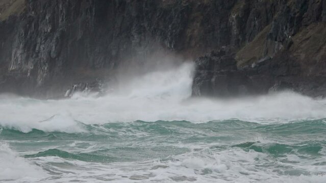 Powerful And Dangerous Waves Hitting The Rocky Cliff During Typhoon In Sandfly Bay, Dunedin, New Zealand. - close up