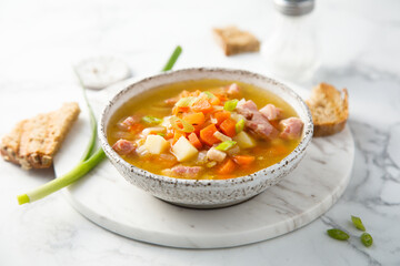 Traditional pea soup with ham and vegetables