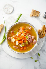 Traditional pea soup with ham and vegetables