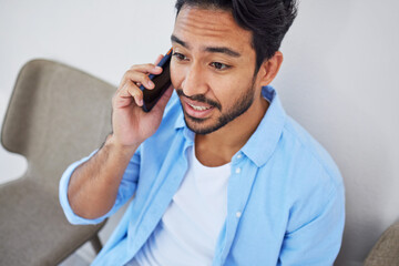 Phone call, waiting and man in the office for hiring meeting with human resources for recruitment. Discussion, professional and person on mobile conversation with cellphone sitting for job interview.