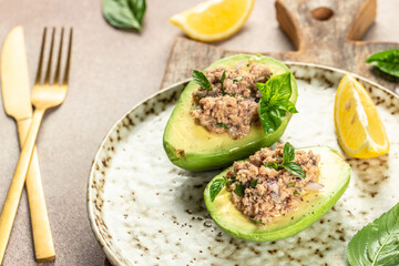 Avocado, tuna salad on plate. organic healthy products. Detox and clean diet concept. place for text, top view