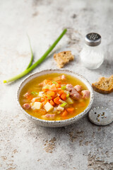 Traditional pea soup with ham and vegetables