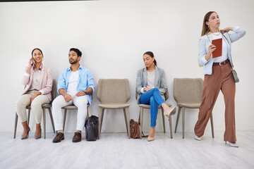 People, waiting room and businesswoman walking to interview at job recruitment agency. Human...