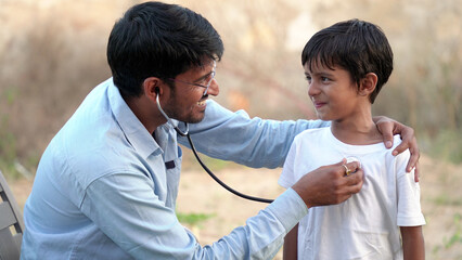 Health checkup, Children medical insurance care. Indian young doctor of pediatrician holding...