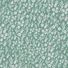 Vector floral seamless pattern. Seamless pattern with white flowers and leaves with stems. Floral elements are highlighted on a green background.