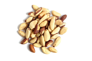 Brazil nuts isolated on white background. Nutty pile of peeled Brazil nuts, top view