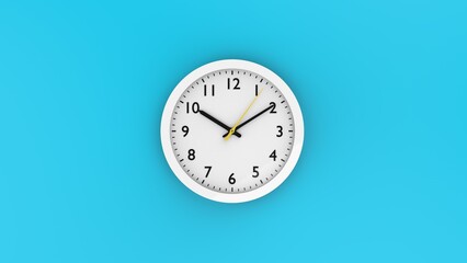 Part of white wall clock with yellow second hand hanging on wall. turquiose blue background