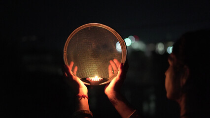 Karwa Chauth strainer and Diya oil lamps for the Karwa Chauth celebration on the night