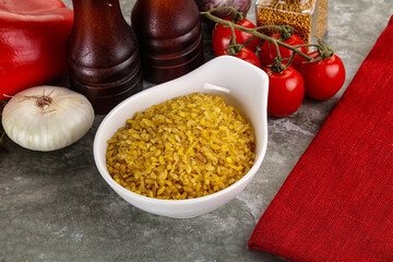 Dry wheat bulgur cereal heap