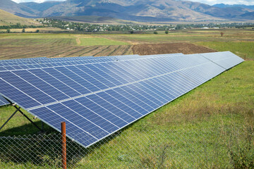 Solar panels in the green field.