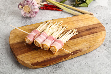 Raw Enoki mushroom with bacon