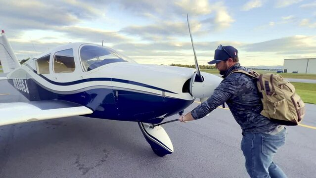 private pilot pushes piper cherokee 180 into hangar