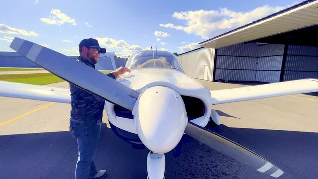 Pilot goes through checklist and prefilight inspection of Piper Cherokee 180 prior to flight