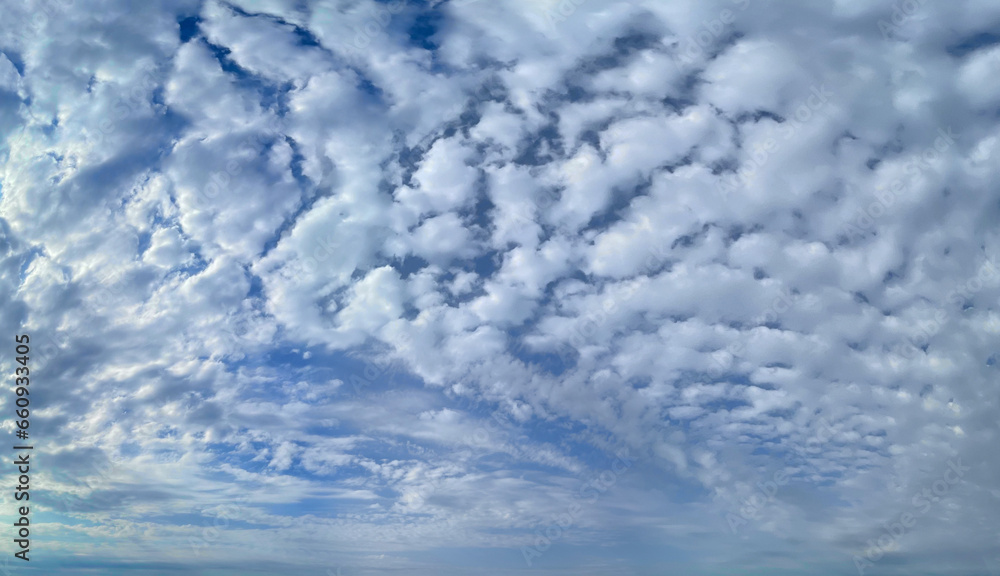 Wall mural white fluffy clouds floating on blue sky background