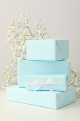 Gift boxes and flowers on white background