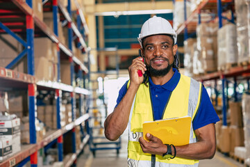 warehouse african black male worker. inventory clerk staff working radio control loading check...