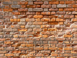 An old red brick wall with lovely texture and pattern.