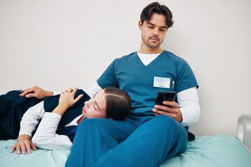 Tired, nurses and break with phone in hospital or sleeping on bed in clinic with friends, fatigue and support. Relax, reading and care for mental health in healthcare with doctors or medical staff
