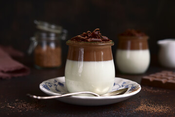 Panna cotta - traditional italian cream dessert in a vintage jars.
