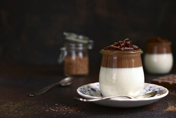 Panna cotta - traditional italian cream dessert in a vintage jars.