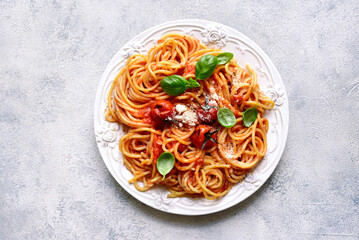 Spaghetti with grilled tomatoes. Top view with copy space.