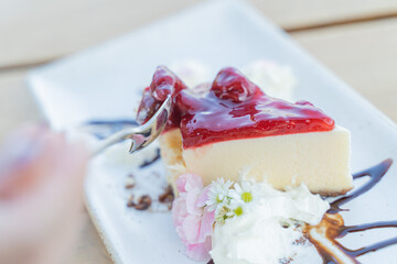 Appetizing white blueberry cake in a cafe next to the sea, Sue Flamingo, Ao Yon Beach, Phuket Thailand