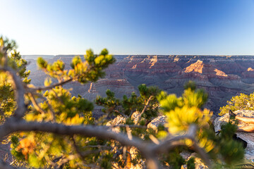 The Grand Canyon is a mesmerizing sight at sunset, where the vibrant, colorful sky meets a blurred...