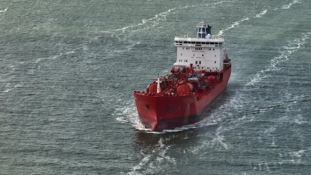 Oil Tanker Ship Sailing Transporting Oil Fuel Gas Or Chemicals Over Sea Seen From Above.