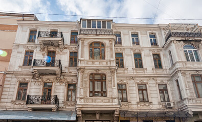 Fototapeta na wymiar Windows and balconies are part of the architecture of old Odessa. They are incredible and authentic. 