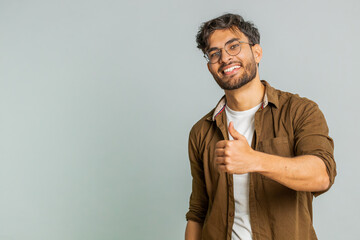 Like. Indian man raises thumbs up agrees with something or gives positive reply recommends...
