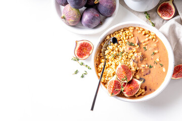 Healthy breakfast bowl with granola and figs