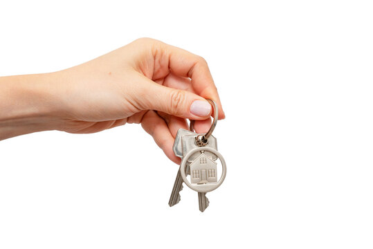 Woman holding keys with house shaped keychain