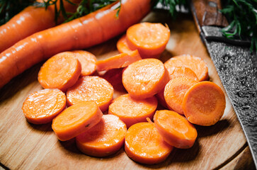 Fresh chopped carrots on a cutting board.
