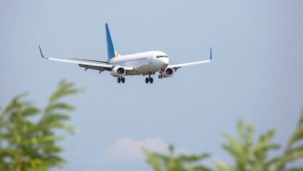 Passenger jet plane flies in the sky. Air transport industry