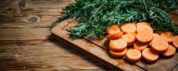 Fototapeta na wymiar Fresh chopped carrots on cutting board.