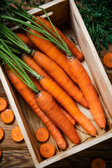 Fresh carrots in old box.