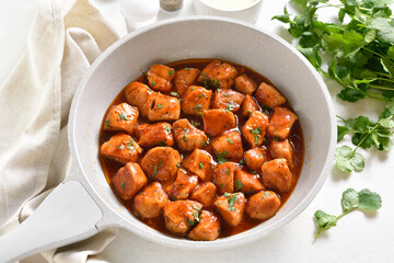 Sweet and spicy chicken bites with sauce
