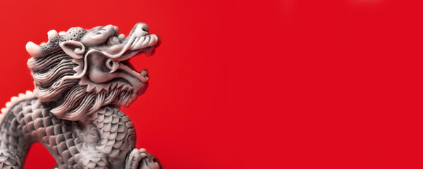 Gray dragon statue on a red background. The symbol of 2024. Happy Chinese New Year. - obrazy, fototapety, plakaty